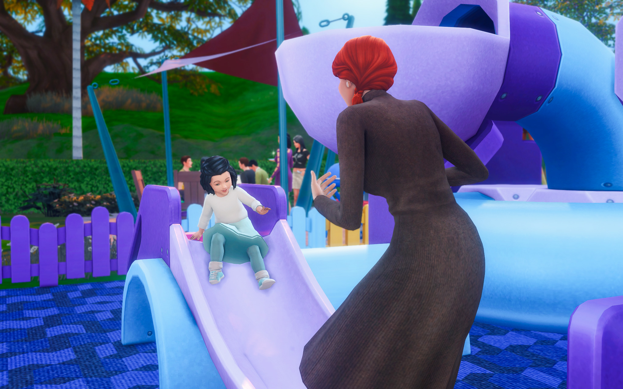 Adelise played with Ennik on a slide.